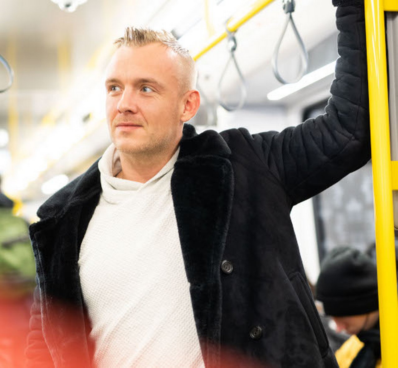 Lukasz is on a bus.