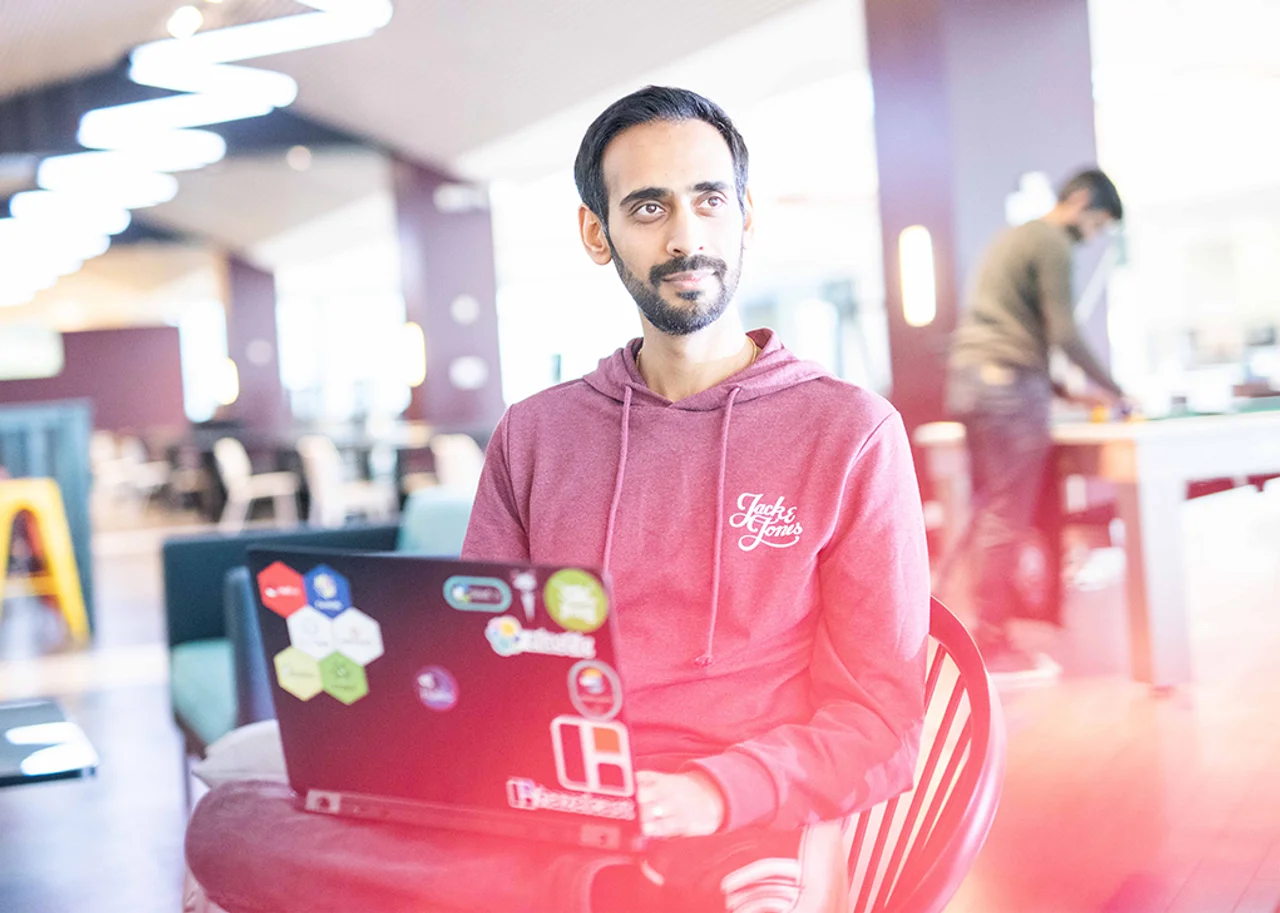 Dipesh with a laptop