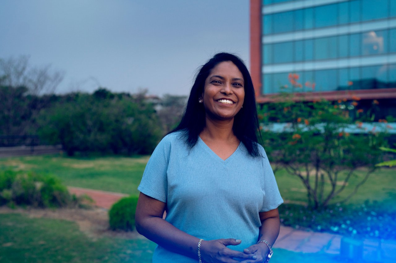 Employee in front of the Deutsche Bank branch in Bangalore