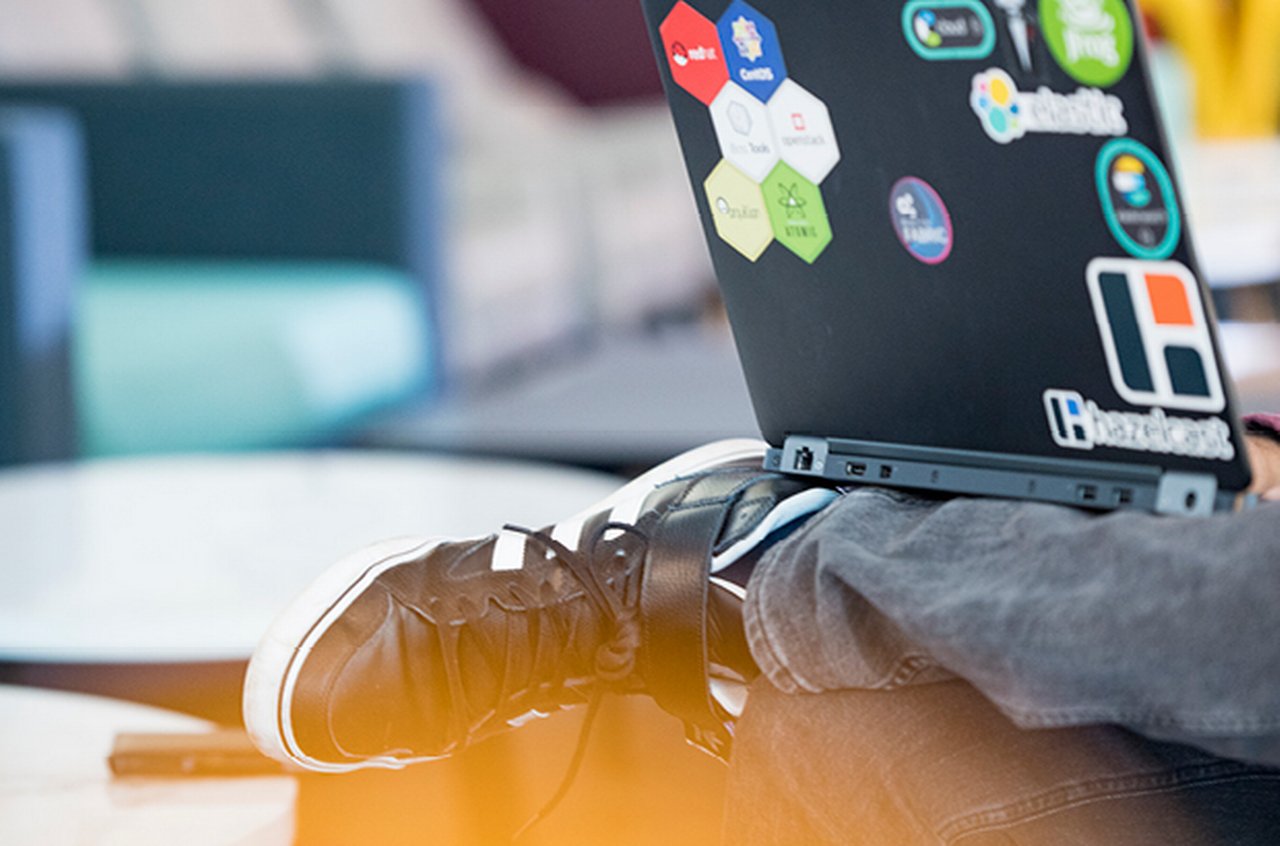 Laptop with stickers on a lap