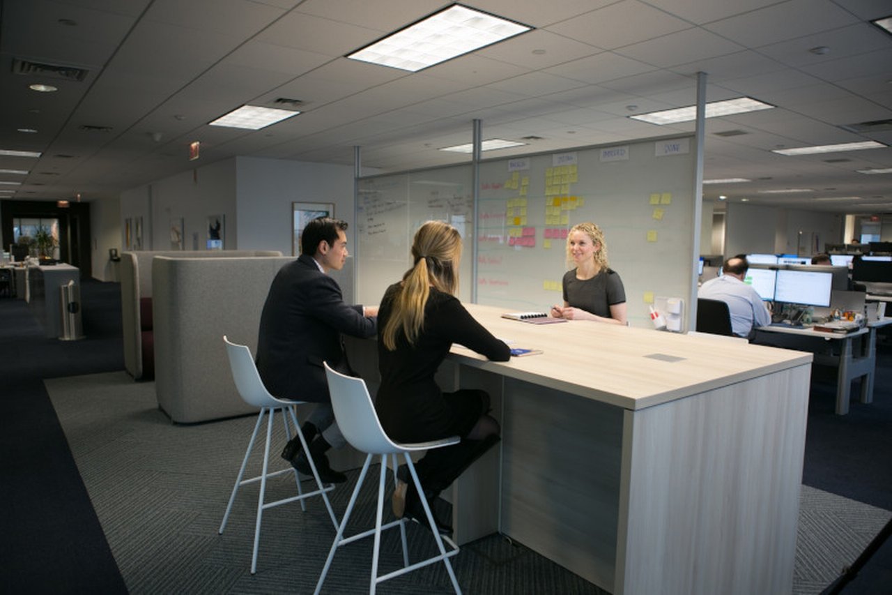 Three collegues in meetingroom