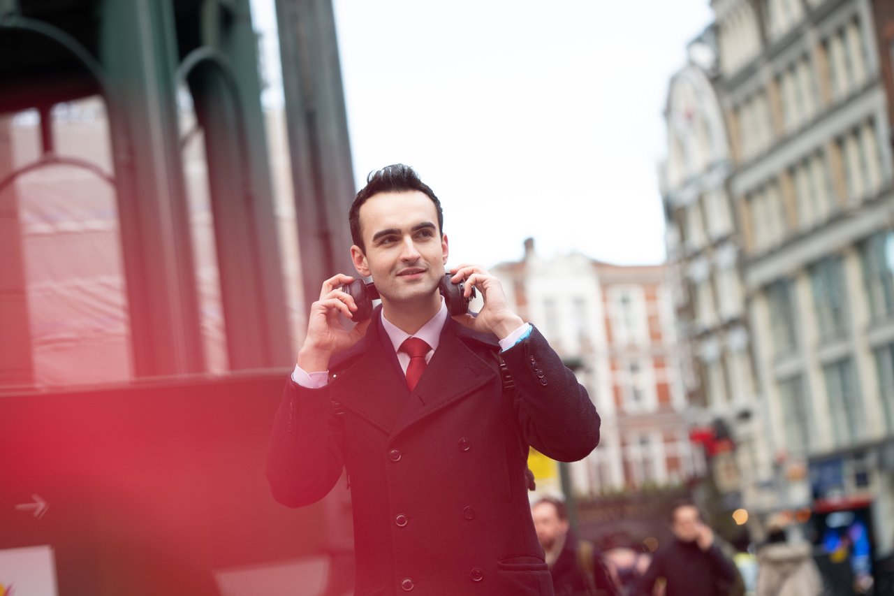 Adam with smartphone in the city
