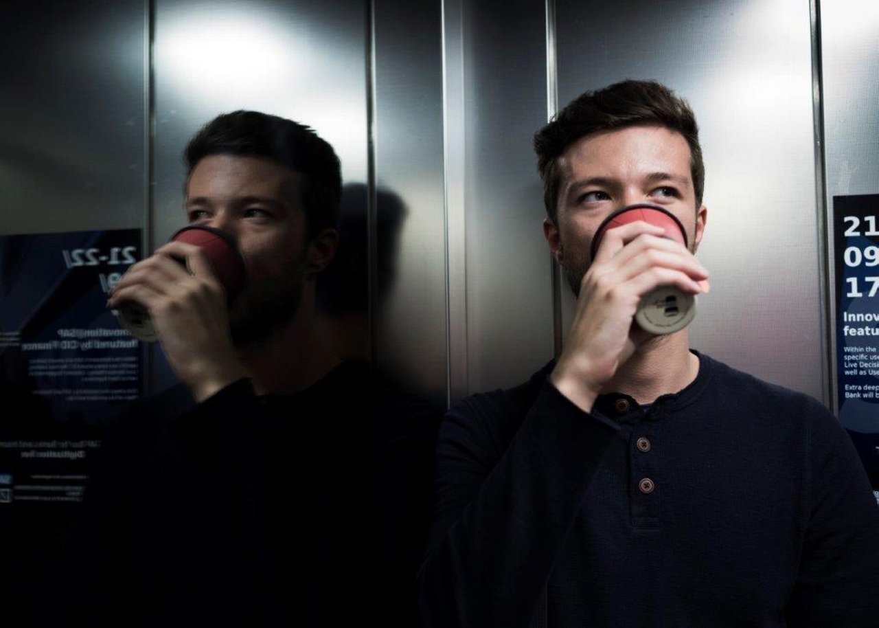 Niklas has a drink in an elevator