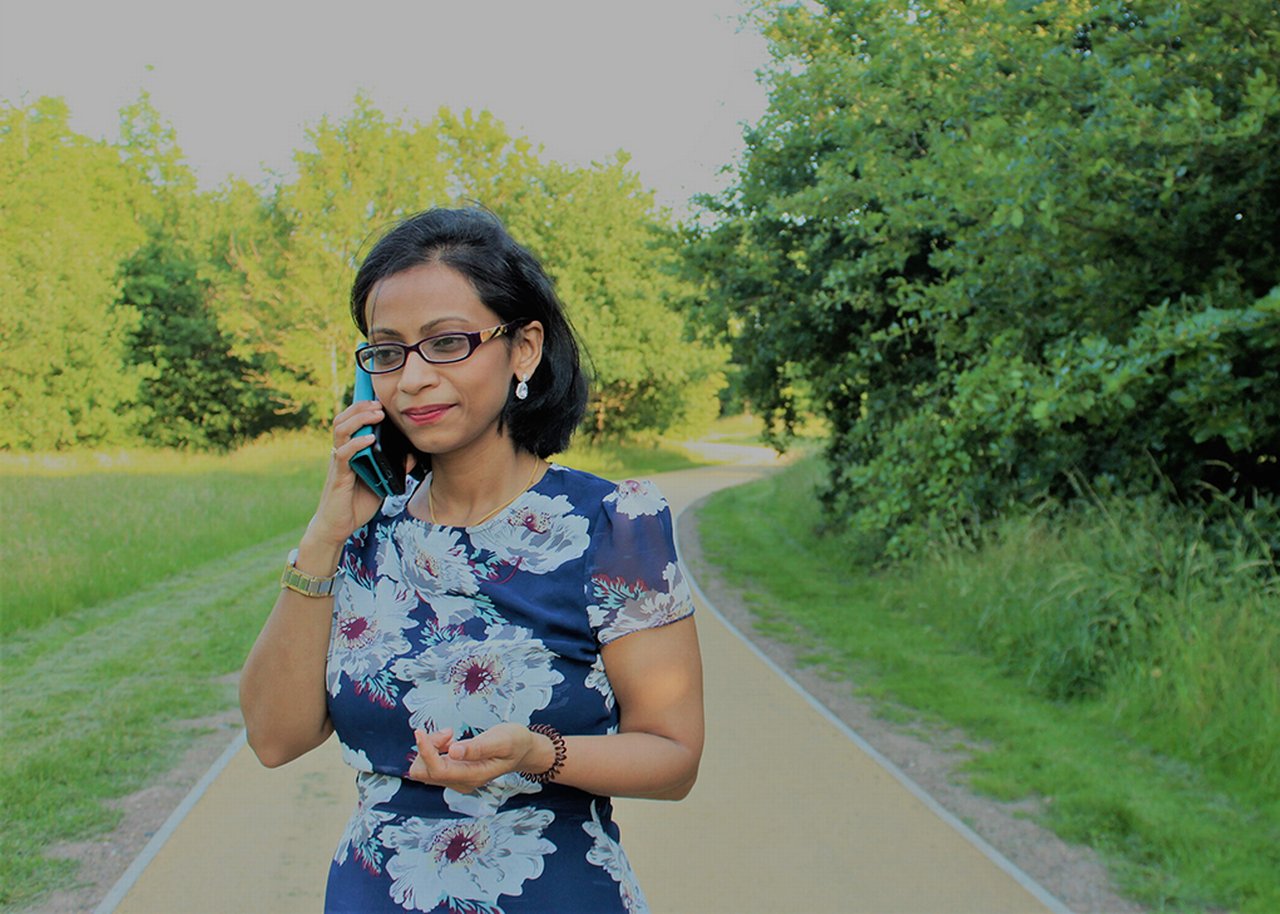 Sandhya outside on the phone