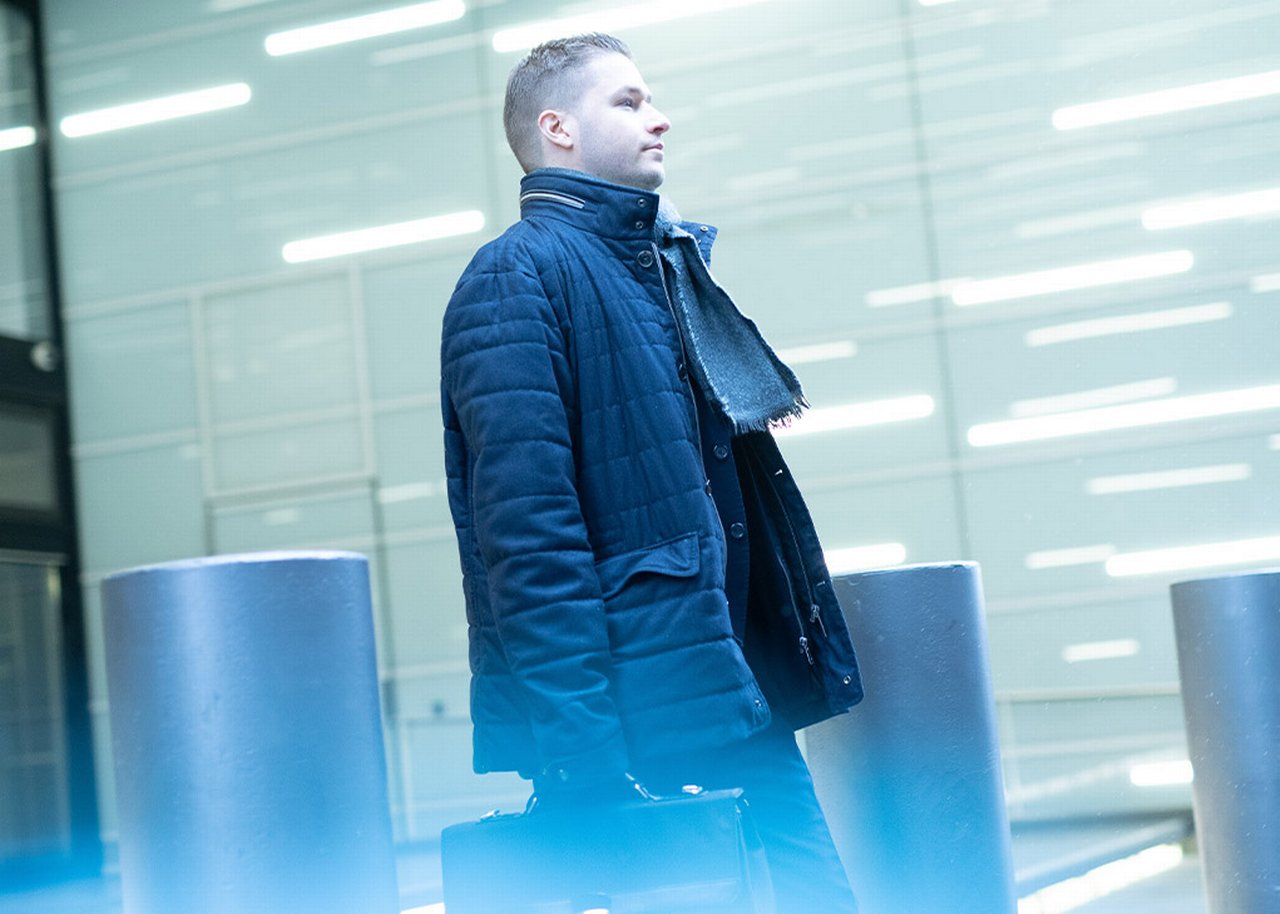 Stevan is walking with a briefcase in his hand