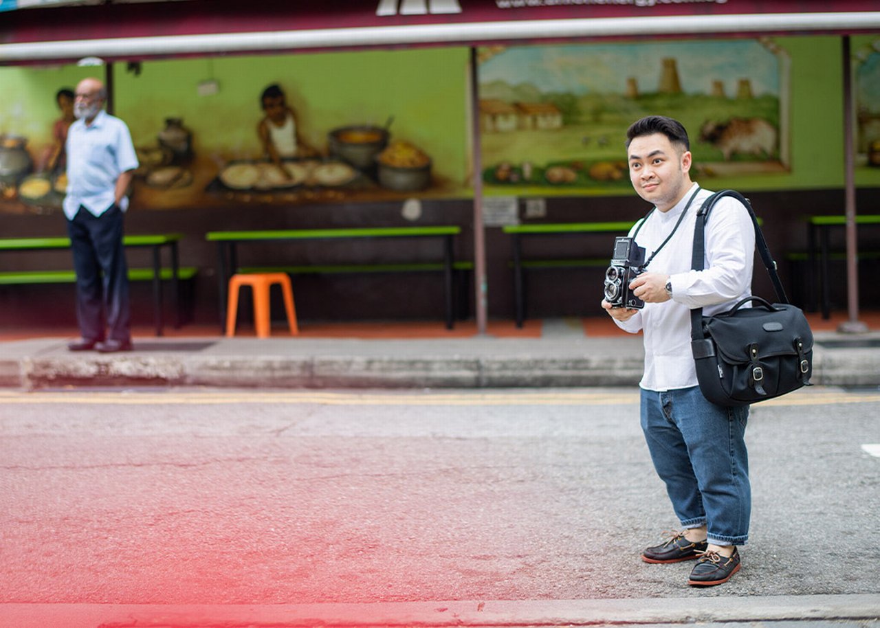 Bryan with a camera on the street