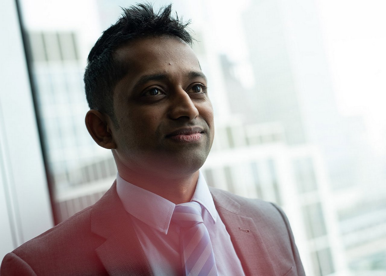 Janagran is standing in his office looking on confidently