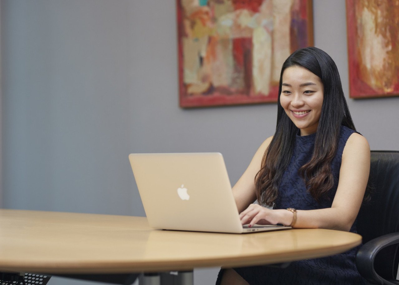 Woman in the conference room with laptop