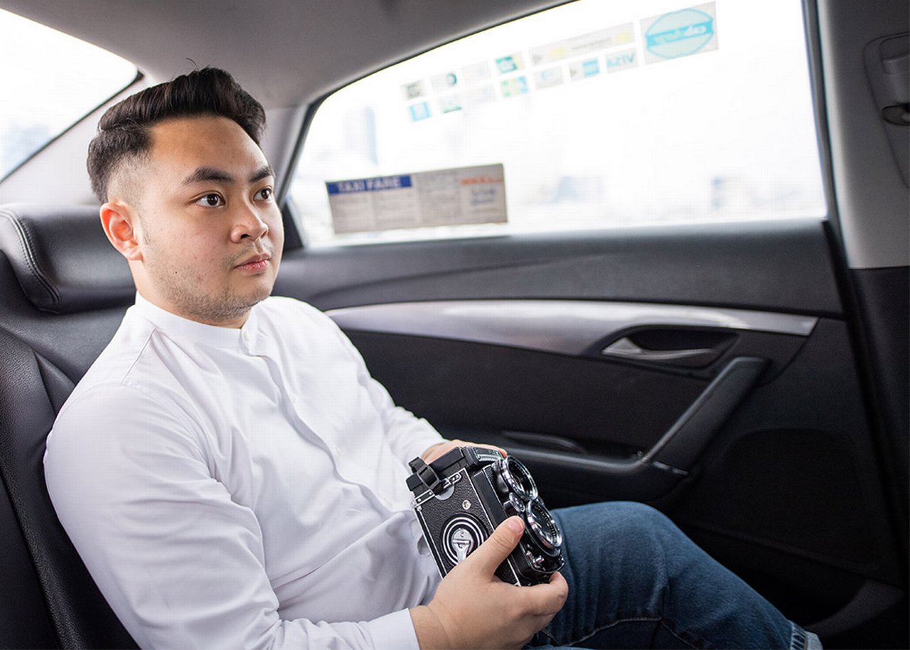 Bryan with a camera in the car