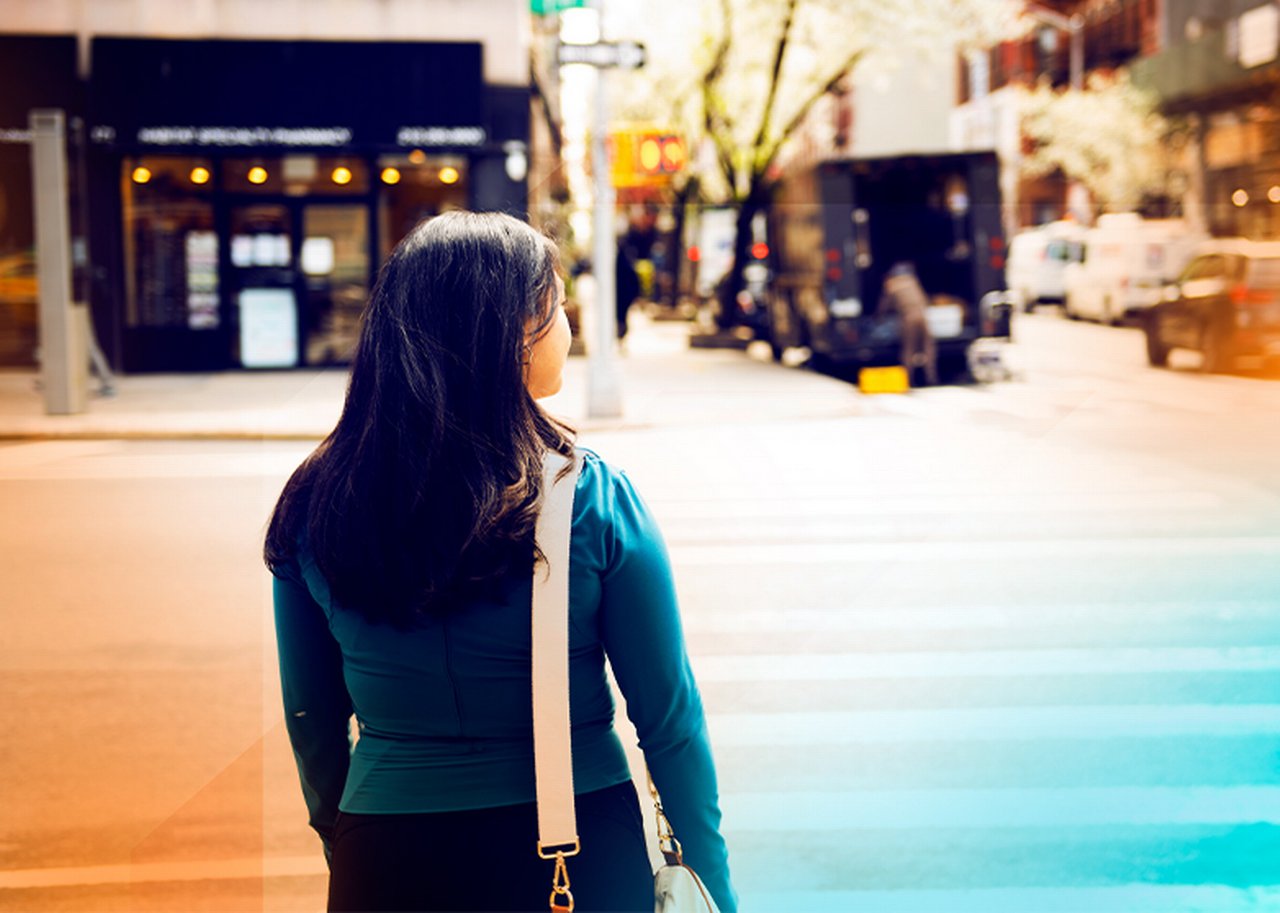 A colleague about to cross the road