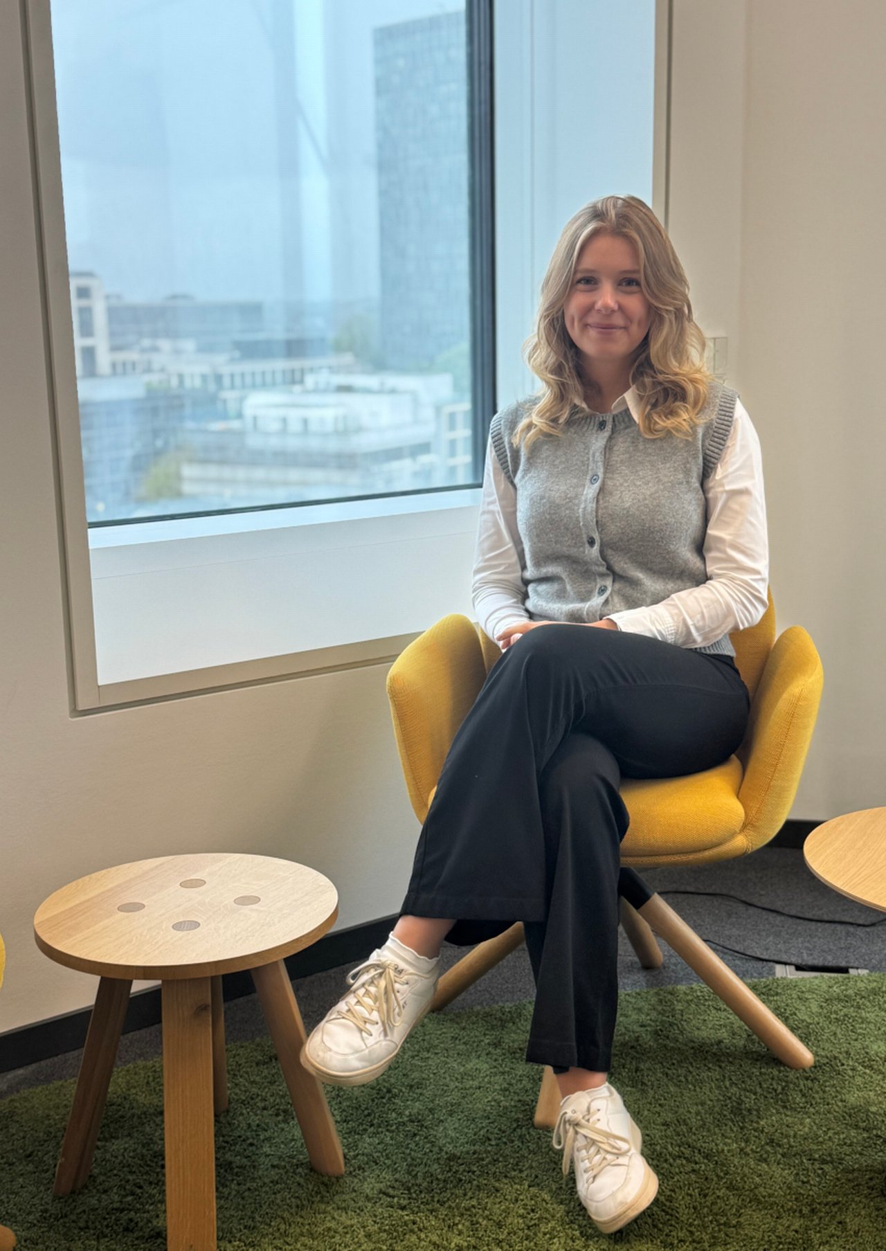 Camilla sitting on a chair
