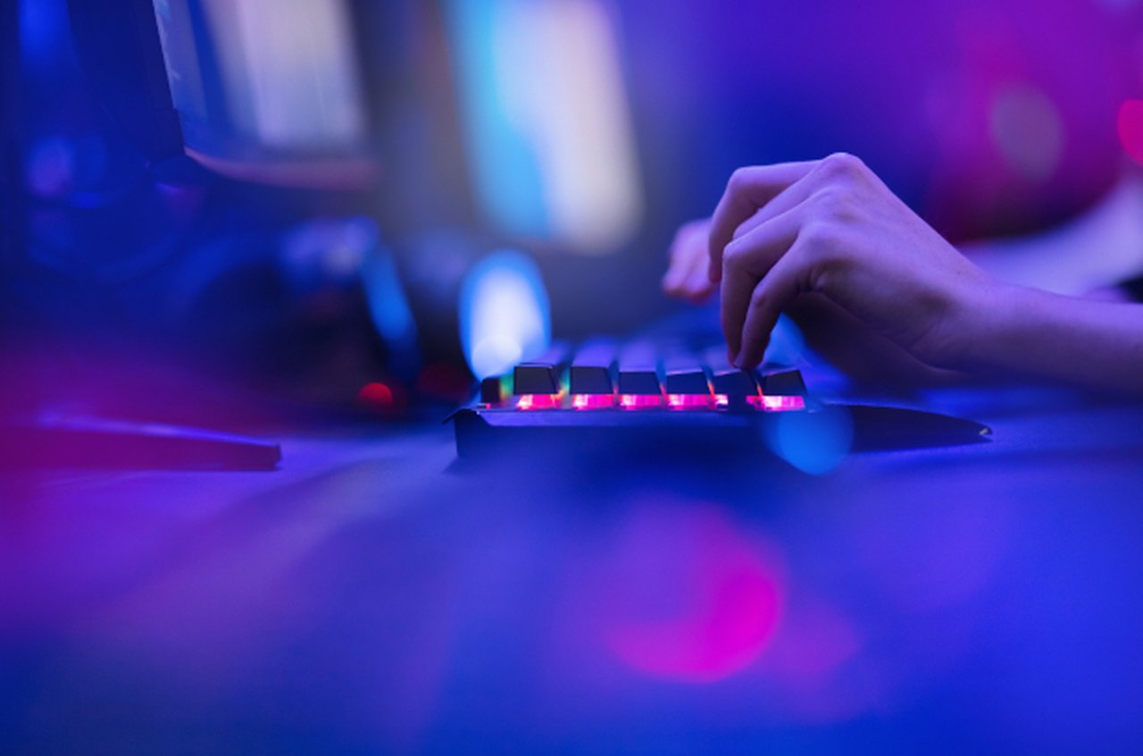 Blue Purple abstract light keyboard and tipping fingers