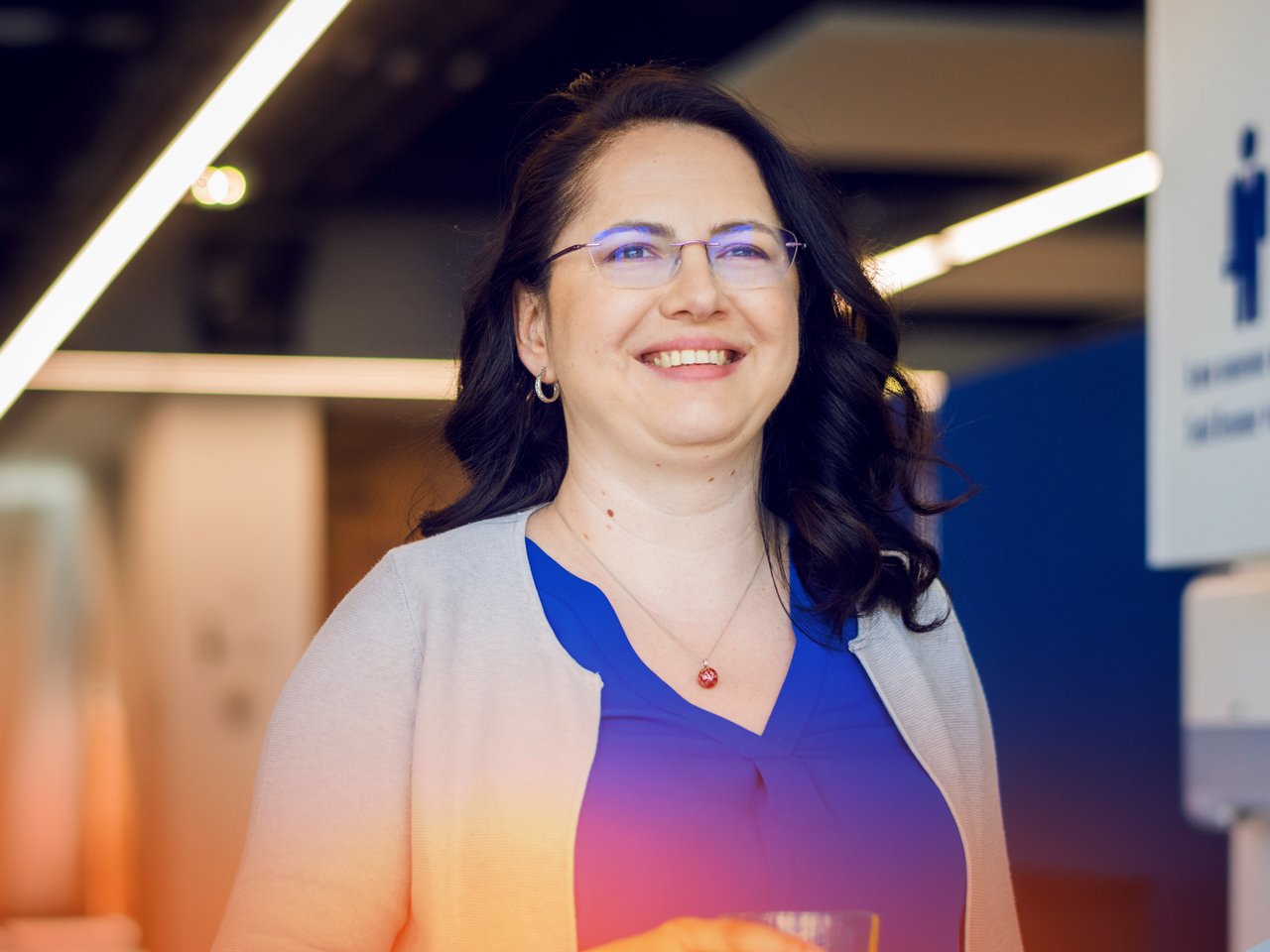 Portrait of a smiling woman with glasses