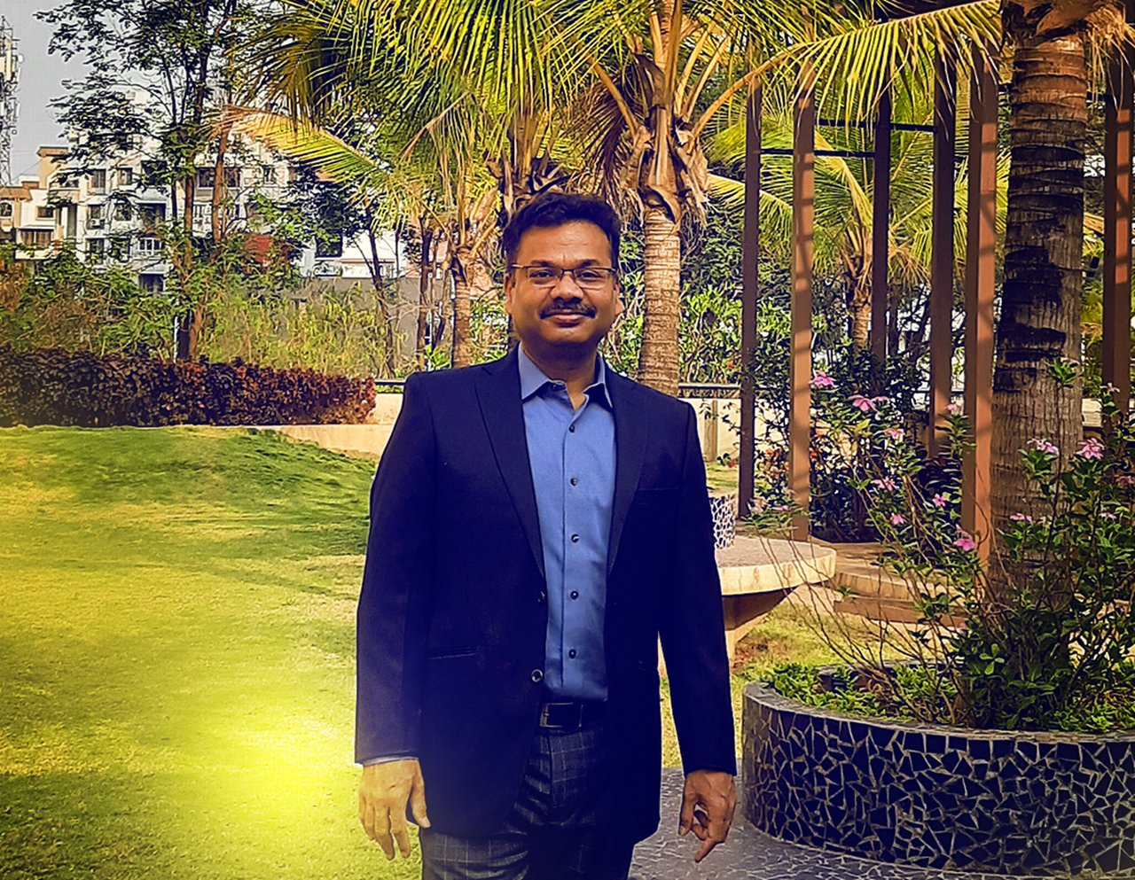 Rohit is standing in a garden