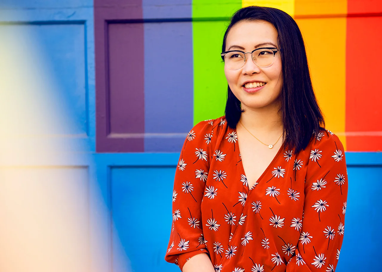 Tina in front of a brightly painted door