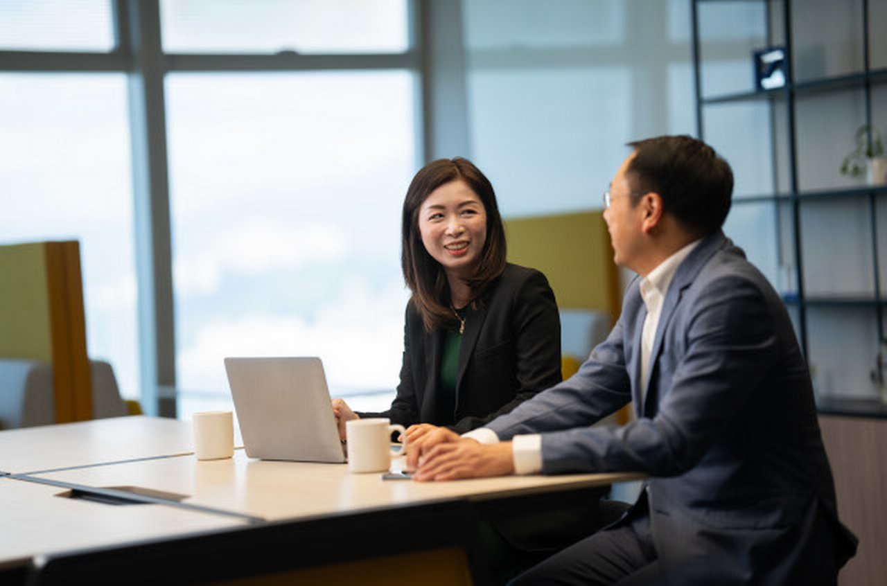 Employees in conference room at Deutsche Bank office in Hong Kong