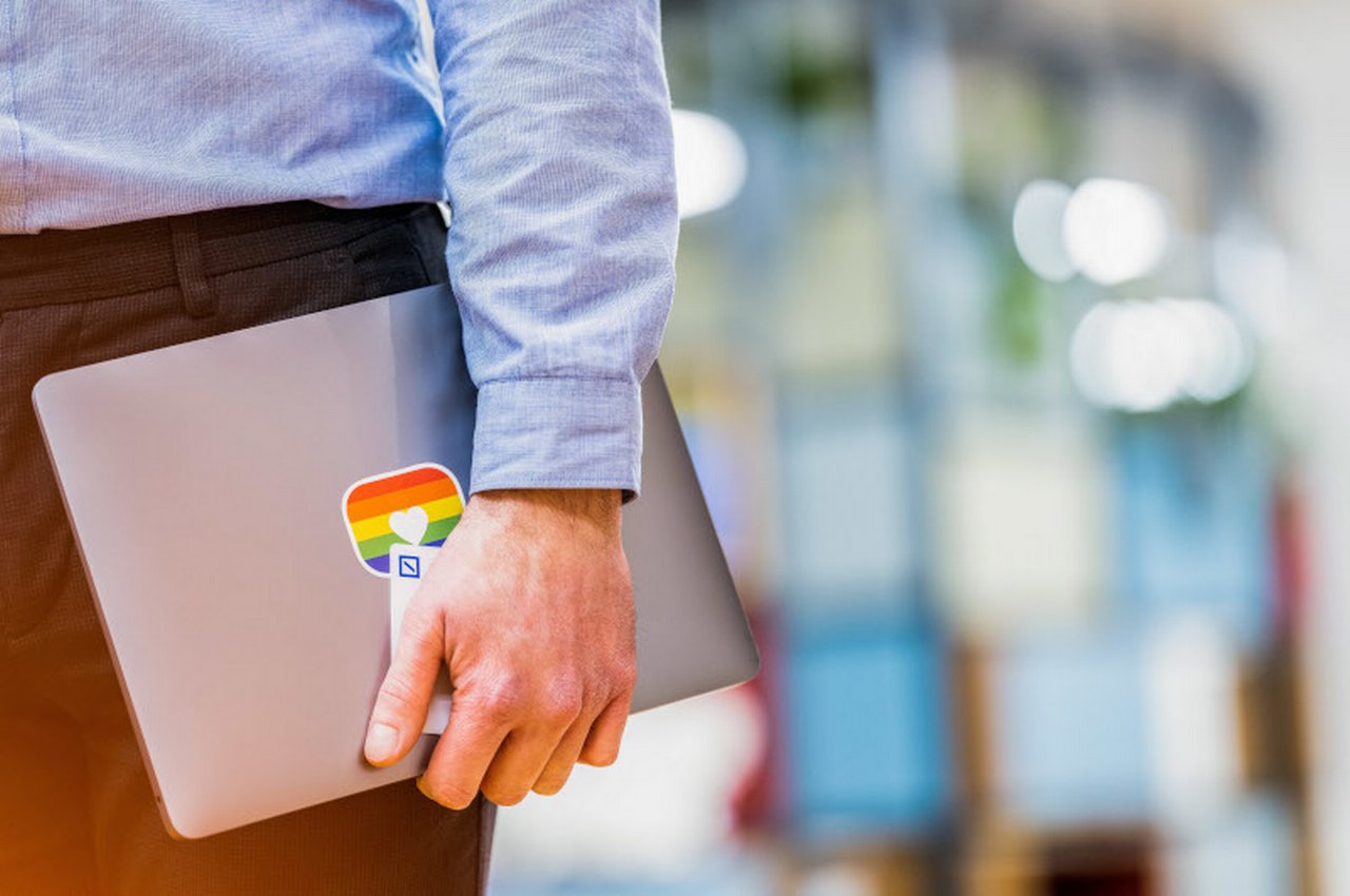 Man with laptop in hand