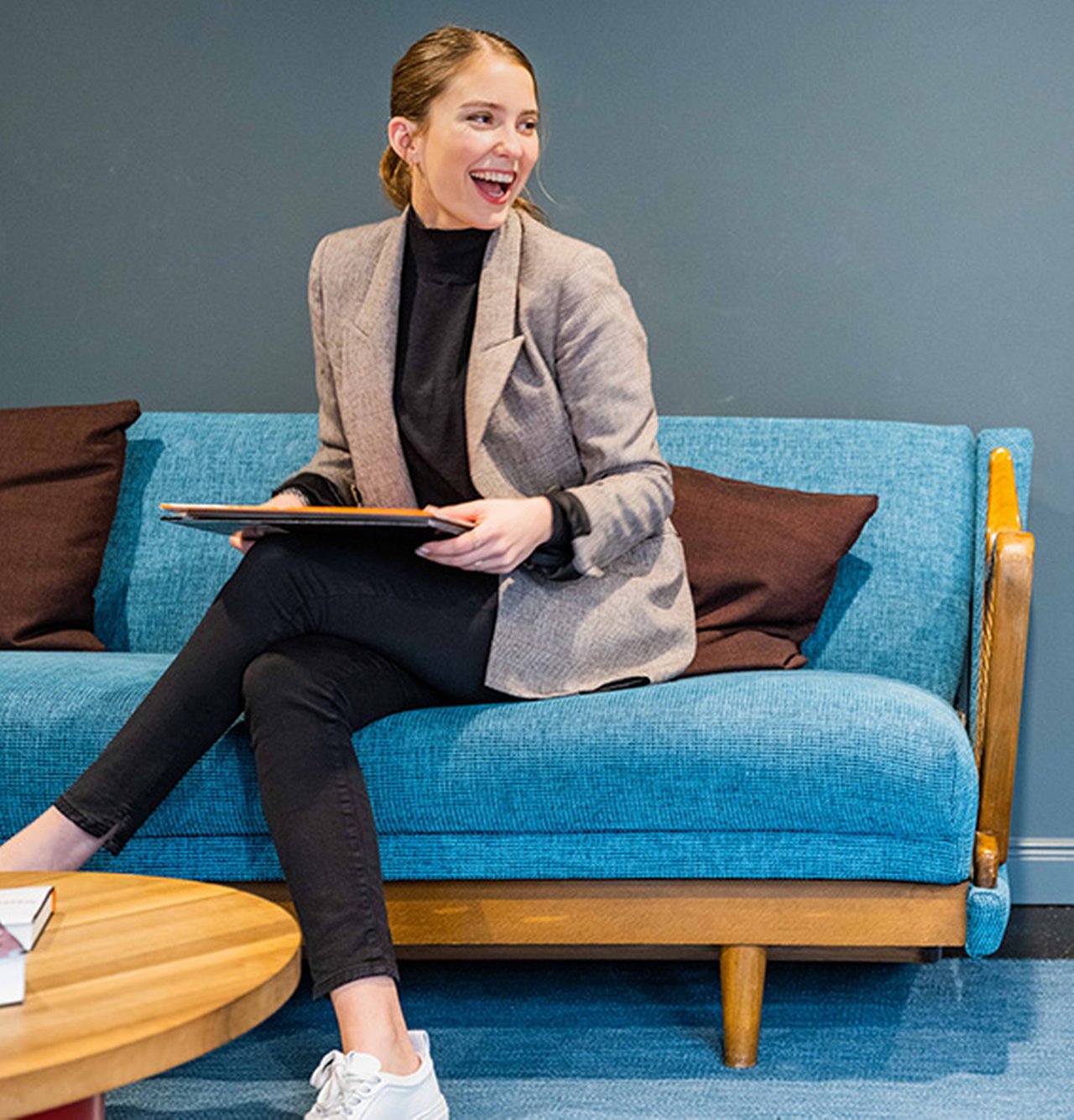 Woman-sitting-on-sofa-working_new.jpg