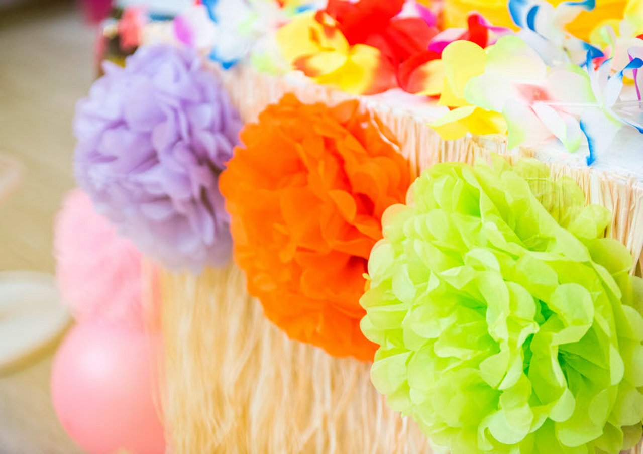Colorful paper flowers in basket